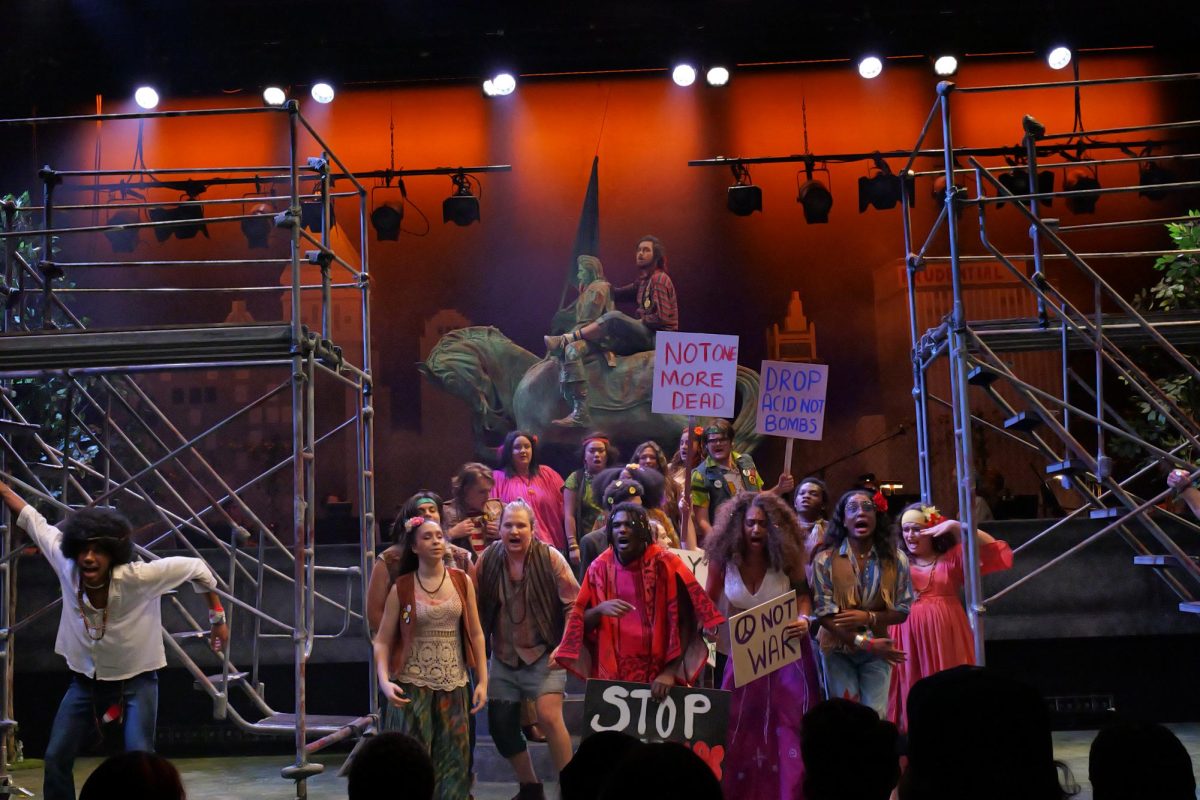 In their performance of "Hair," students act out a protest of the draft and the war at the Theatre building at 72 E. 11th St. on Thursday, Nov. 7, 2024. 