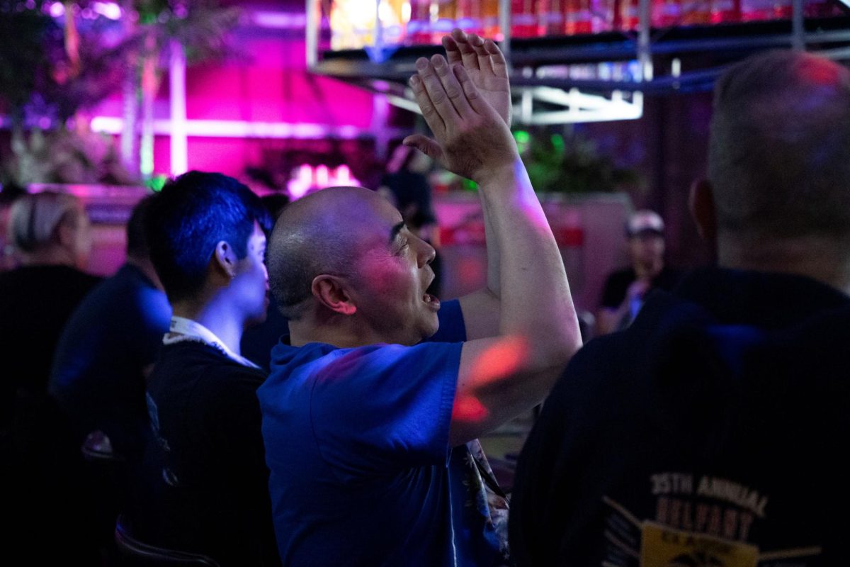 Attendees begin to cheer when hearing news of Vice President Kamala Harris making progress in several East Coast states during the 'Election Day at Side Track' event at 3349 N. Halsted St. on Tuesday, Nov. 5, 2024.