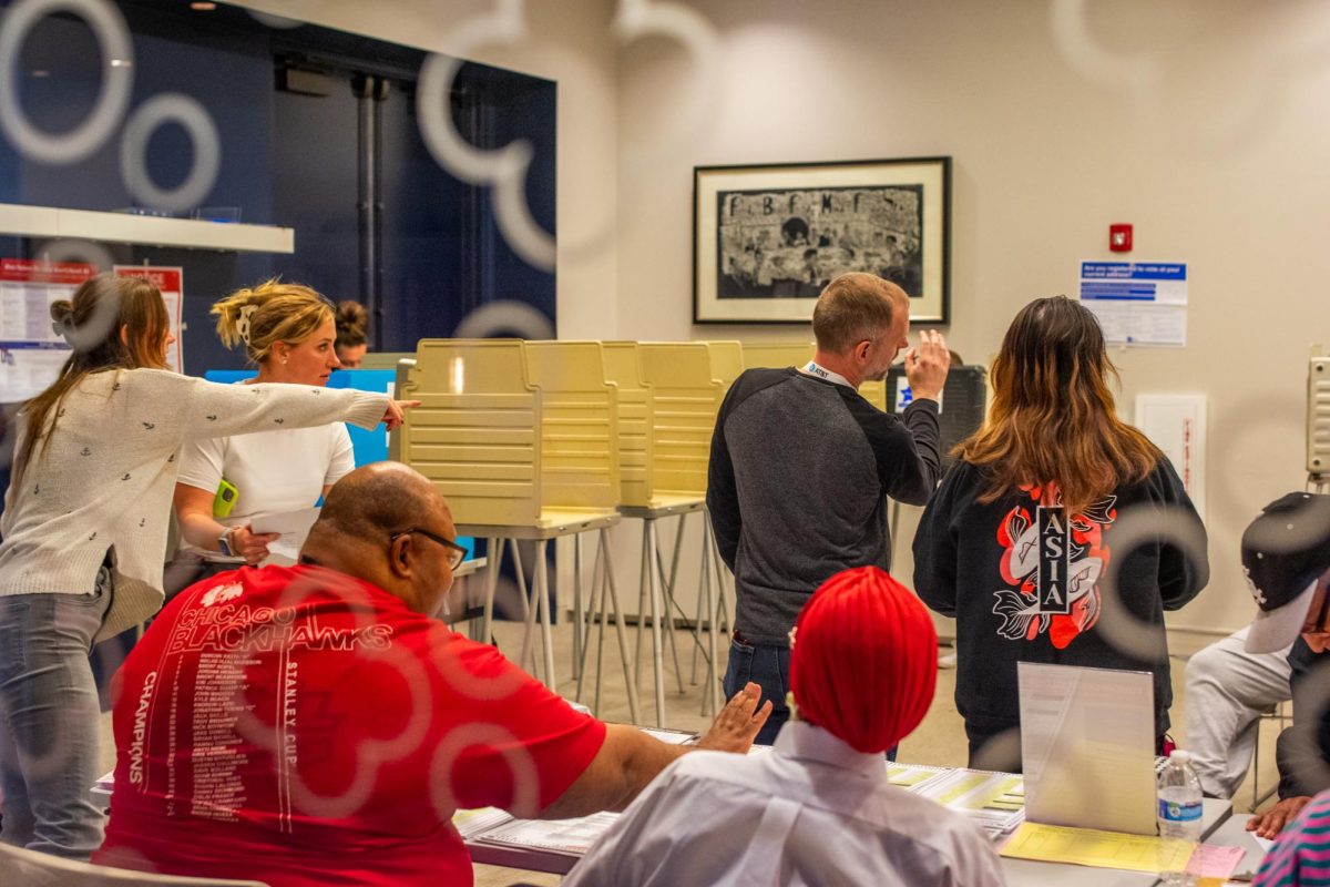 ​​Chicago residents vote at Fourth Presbyterian Church, an official polling center at 126 E. Chestnut St., on Tuesday, Nov. 5, 2024.