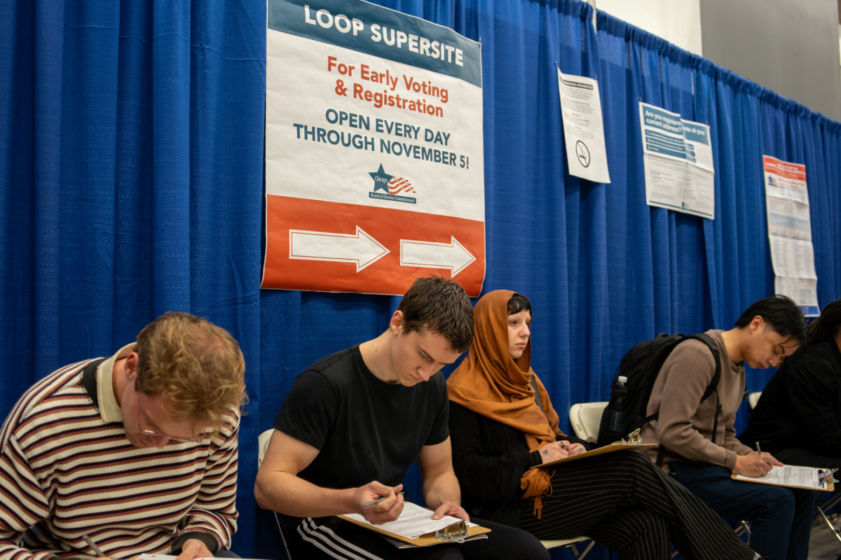 Voters prepare to cast their ballot at the Voting Super Site at 191 N clark st. in Chicago on Tuesday November 5, 2024