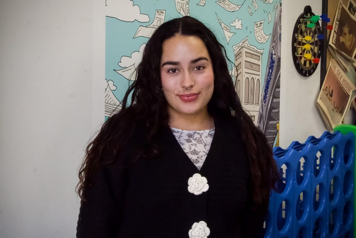 Current Newsletter Producer and copy editor at the Columbia Chronicle, Doreen Abril Albuerne-Rodriguez poses for a photo in the Chronicle office on Monday, Dec. 3. Albuerne-Rodriguez will be the new editor-in-chief at The Chronicle this coming spring semester.