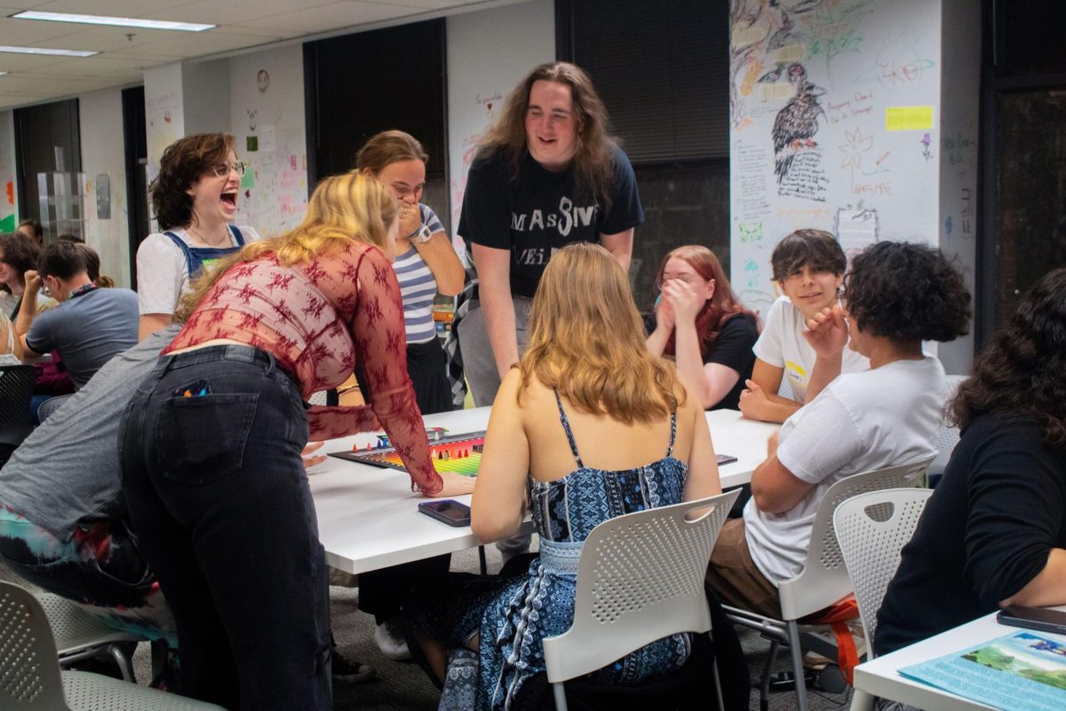 Students laugh and cheer after discovering the correct answer for their round of "Hues and Cues" at Board Game Night at Columbia College Chicago on Thursday, Sept. 26, 2024.