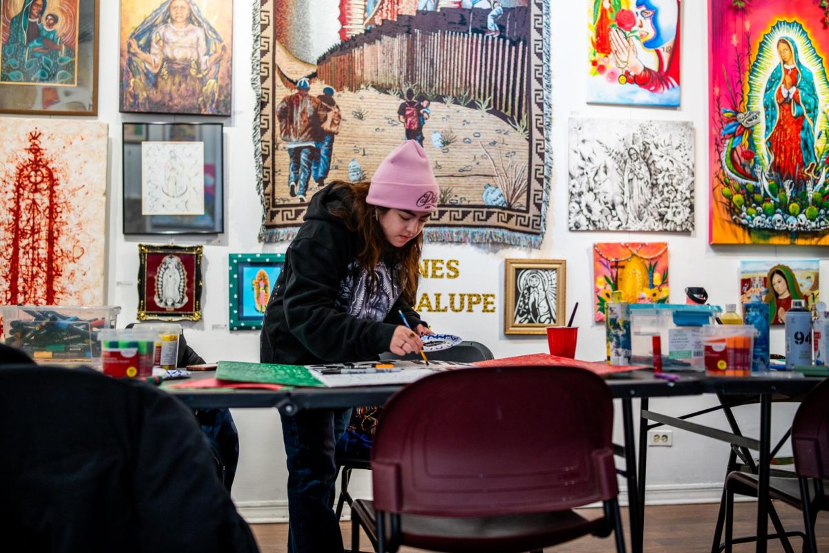 Isabella Centeno participates and makes signs and banners for the Party for Socialism and Liberation movement at the Community Resistance Through Art and Literature event hosted by Pilsen Arts and Community House, 1637 W. 18th St. on Thursday, Jan. 24, 2025.