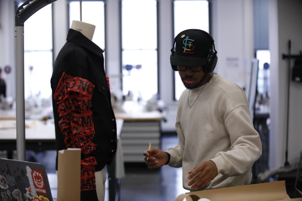 Tommie Anderson, a sophomore fashion studies major with a focus on product development, works on his class project in the fashion design studio at the 623 S. Wabash Ave. building on Tuesday, March 18, 2025.