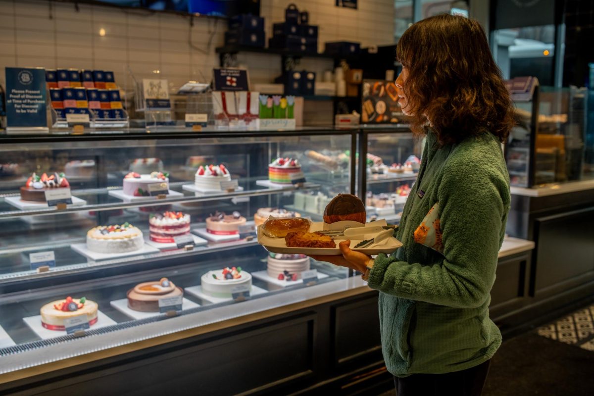 A woman waits in line at Paris Baguette, a popular South Loop café, on Friday, April 25, 2025.