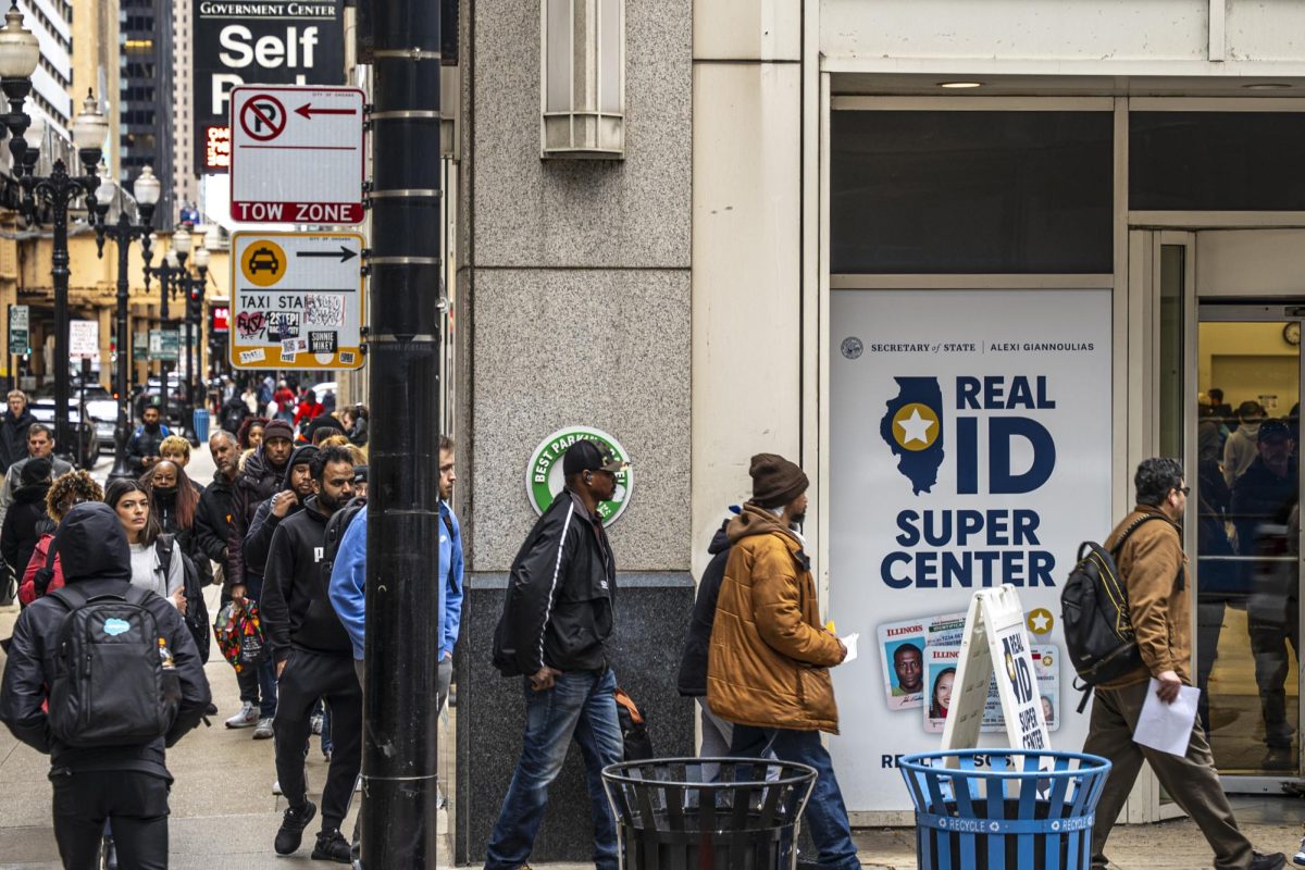 A large group cornering down W Lake St waits in line at the Real ID Super Center on Monday, April 21, 2025. Real IDs, or an acceptable alternative such as a U.S. passport, will be required to board domestic flights or enter secure federal facilities after the May 7 deadline.