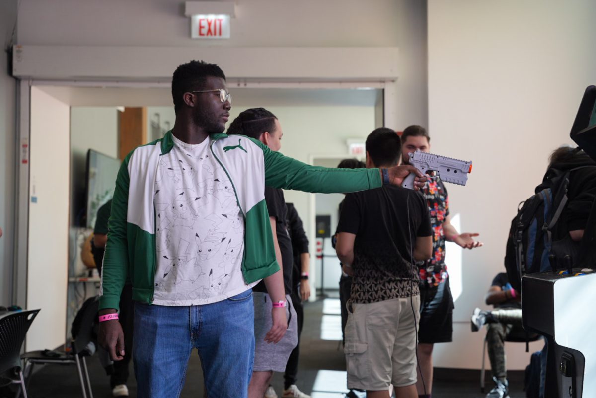 Isaac Christophe, a junior game design major, plays a game at the Game Studio Capstone event at 916 S. Wabash Ave. on Friday, May 16, 2025.