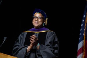 Senior Vice President and Provost Marcella David applauds graduates at the afternoon ceremony at Credit Union 1 Arena on Sunday, May 18, 2025.