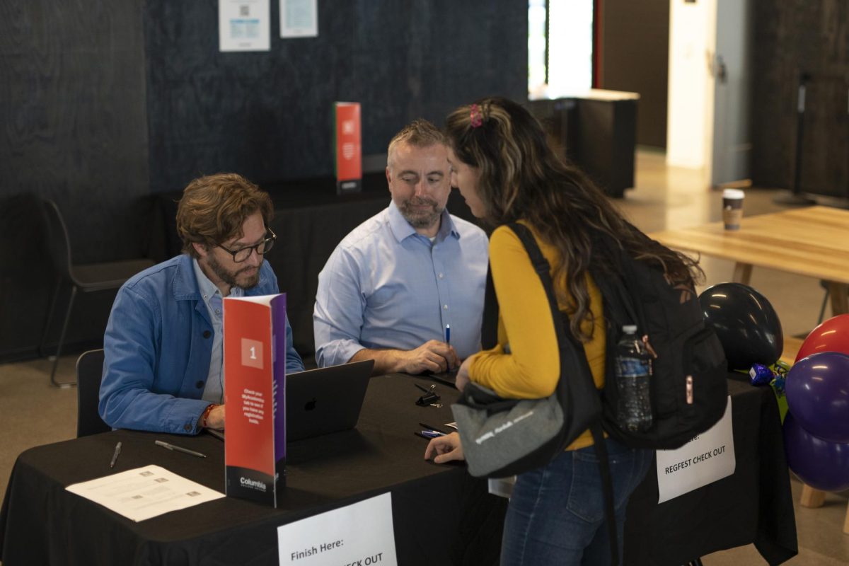 Students line up for RegFest check out with Associate Provost for Student Retention Greg Foster-rice and Dean of Students Douglas Eck in the Student Center on Thursday, Oct. 26, 2023. 