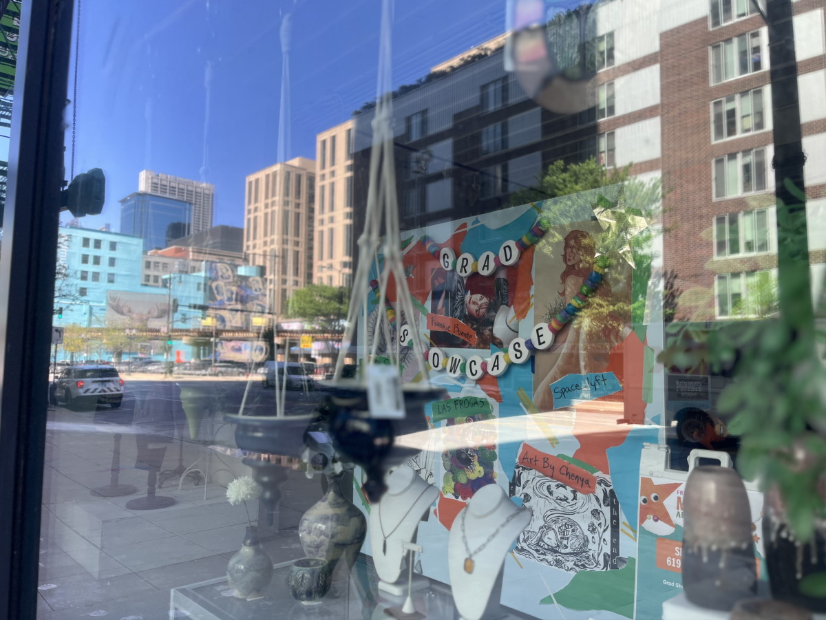 The graduate showcase is seen through the window of ShopColumbia at 619 S. Wabash Ave on Friday, May 16, 2025. The artist reception for the showcase will be held from 4 p.m. to 6 p.m.