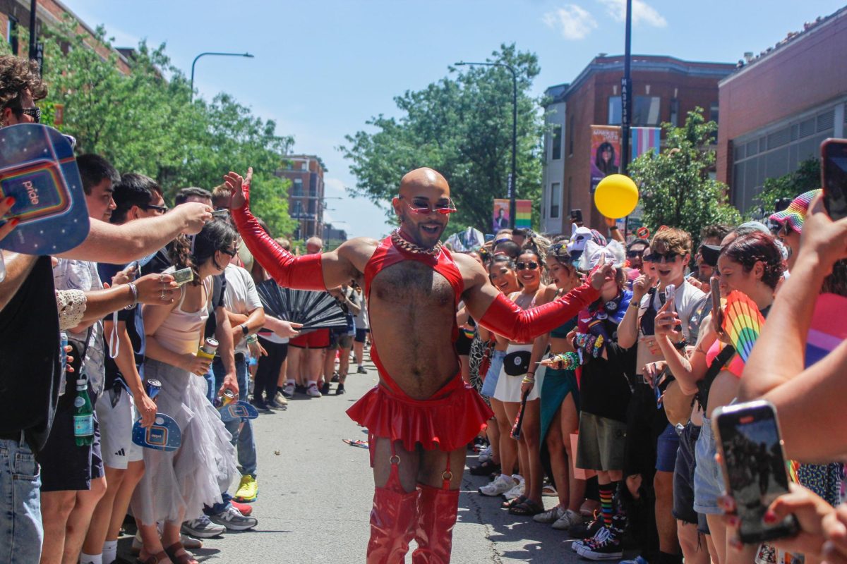 Performer of Pride Fest's Drag Show struts down the crowd on their way to the stage on Saturday, June 21, 2025.