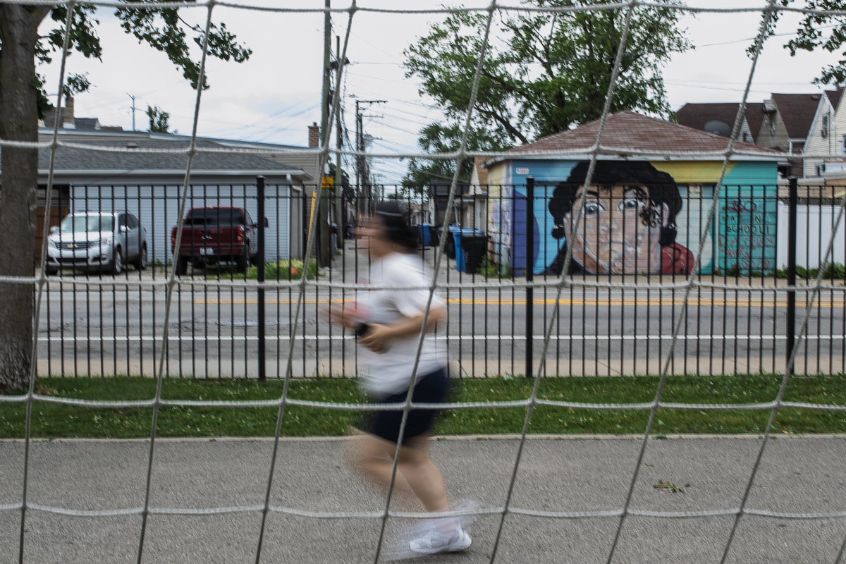 Pamela Alanis, 22, runs on the track near 31st Street and Lawndale Avenue on Friday, June 27, 2025.