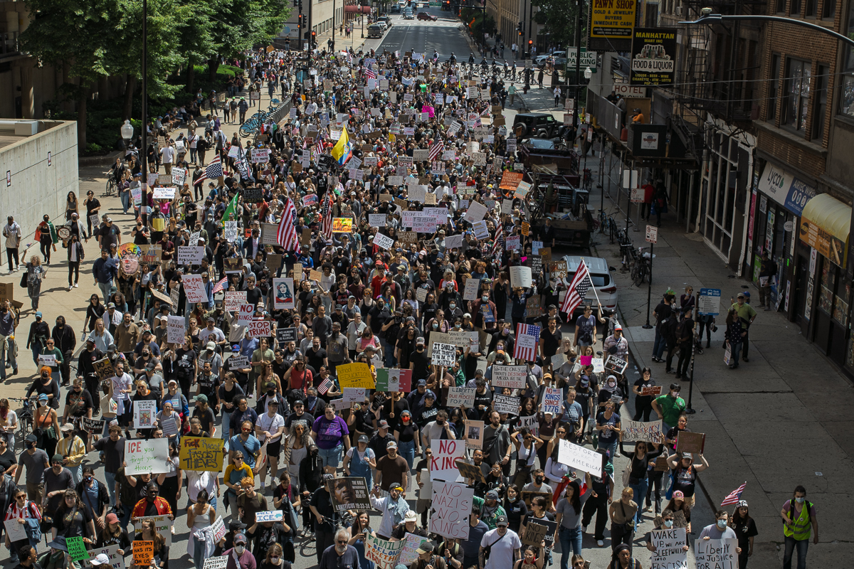 "No Kings" protestors walk down Clark Street on Saturday, June 14, 2025.