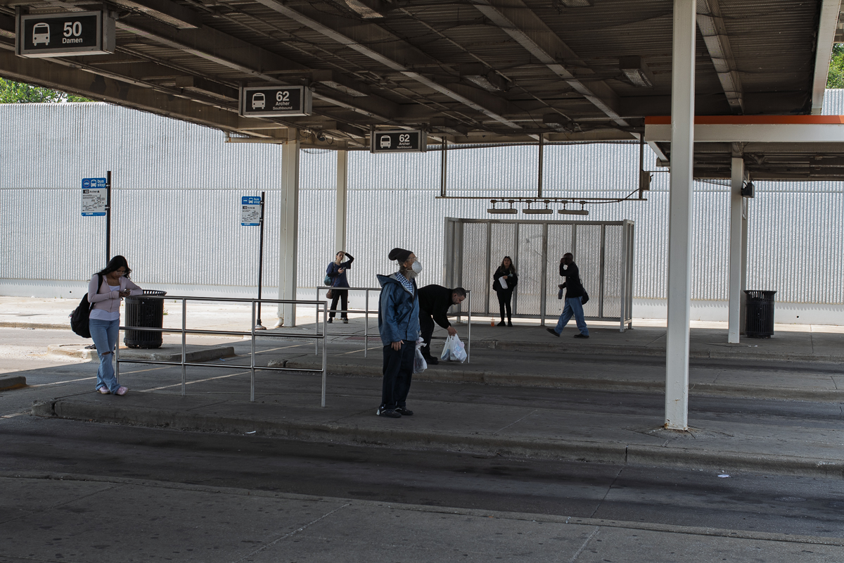 Riders wait for buses at the 35th/Archer Orange Line station on Friday, June 6, 2025. 