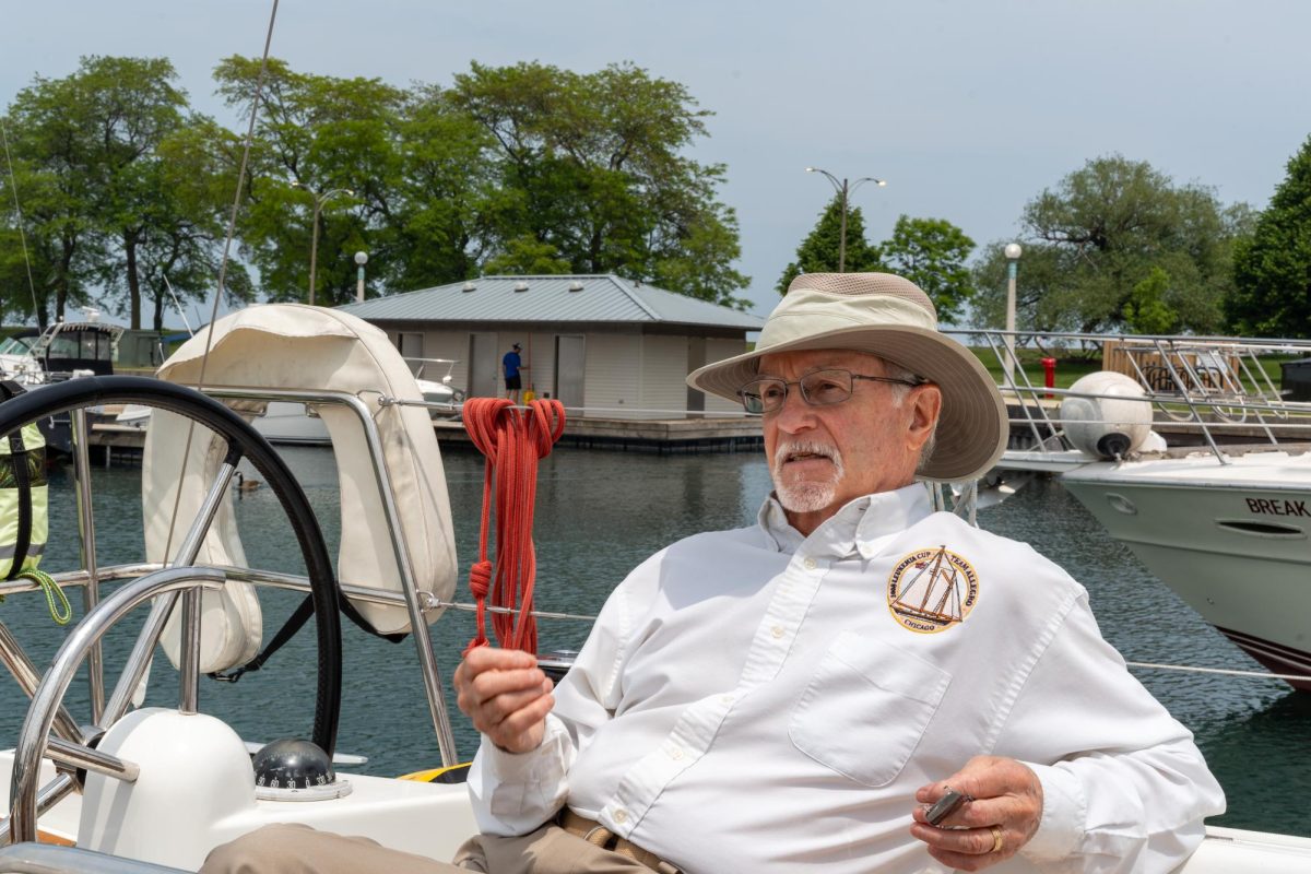 Martin Bernstein, an adjunct professor in the School of Film and Television, sits aboard one of the boats he charters, the Alexa, while docked at Belmont Harbor in Chicago on Thursday, June 12, 2025. 