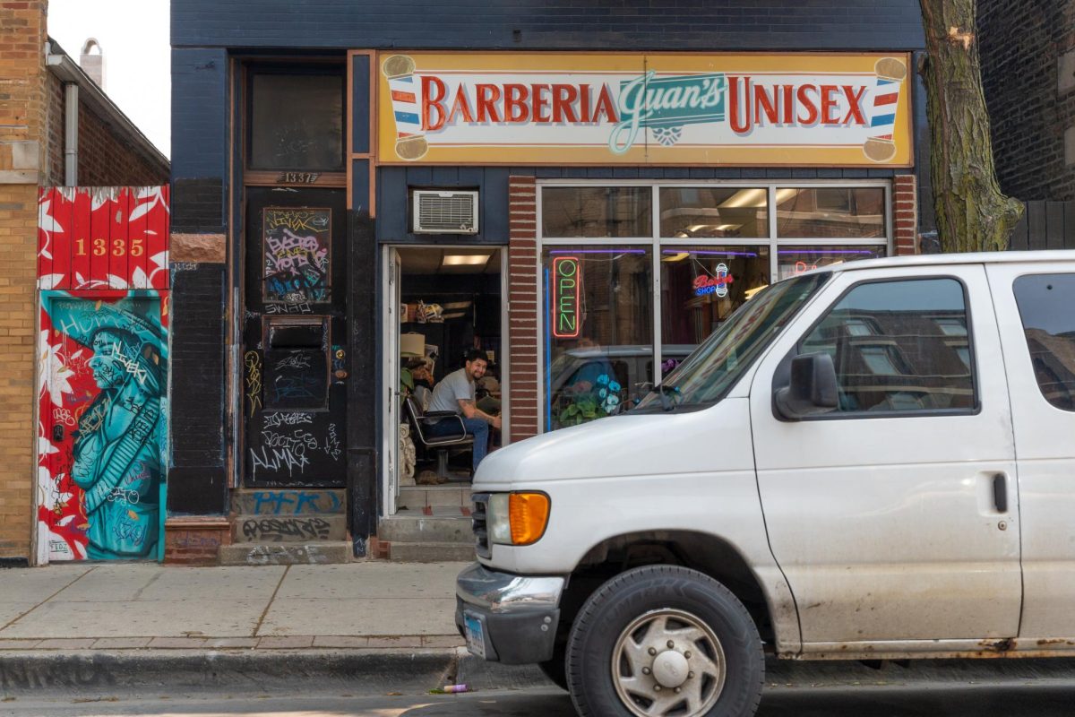Patrons wait in Barbería Juan’s on 18th St. in Pilsen on Tuesday, June 10, 2025. 