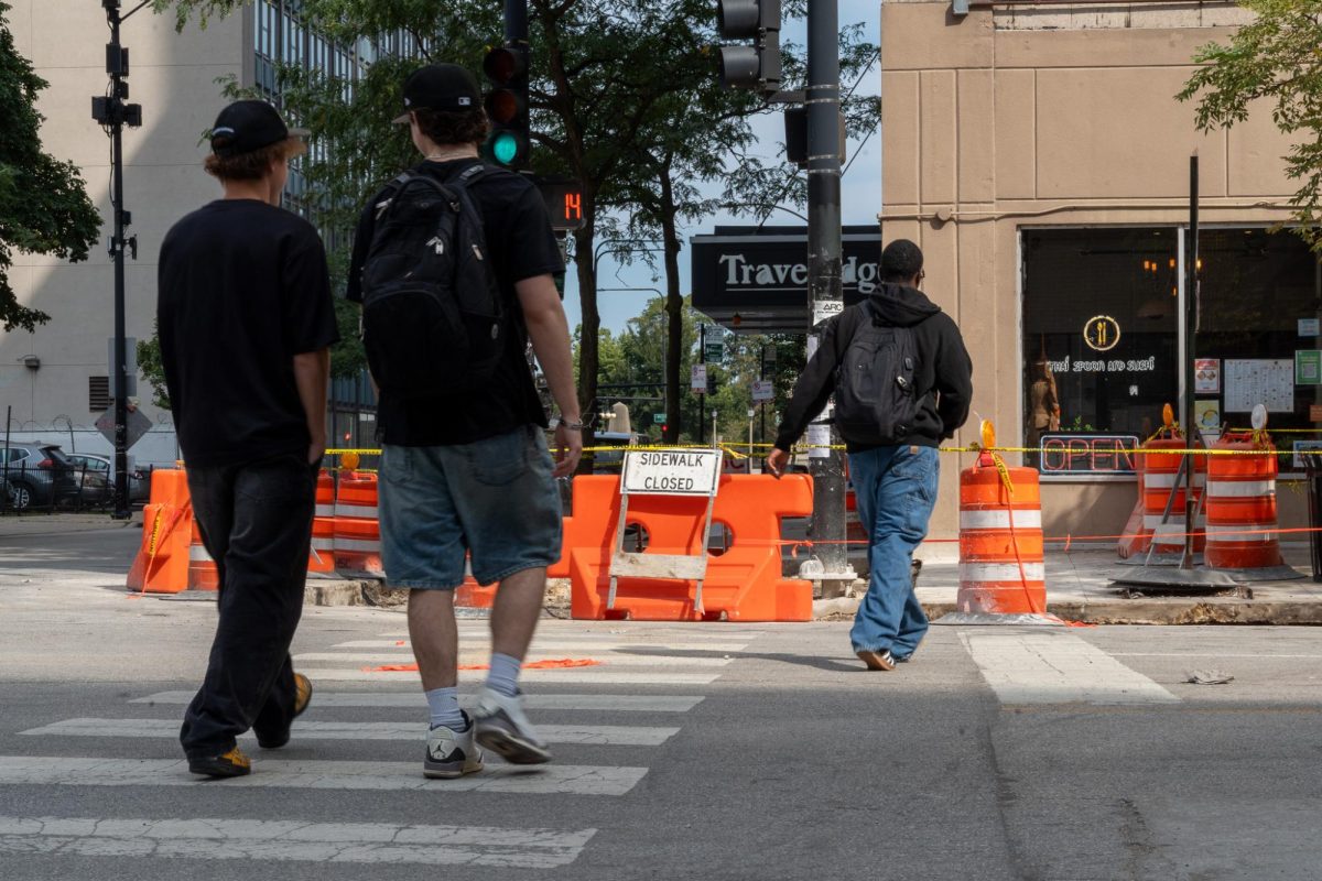 Pedestrians cross South Wabash Avenue amid ongoing construction surrounding campus on Friday, Sept. 12, 2025.
