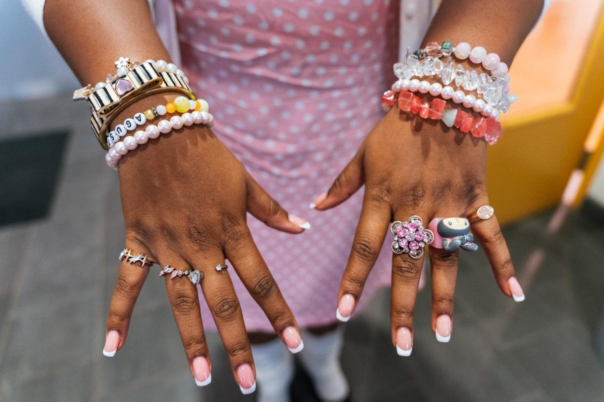Dylan Butler, first-year fashion studies major, shows off her jewelry inspired by Japanese fashion aesthetics at 623 S. Wabash Ave. on Wednesday, Sept. 3, 2025.
