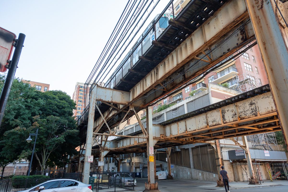 A Green Line train passes over East 14th Place, a street some students use while commuting to campus, on Monday, Sept. 15, 2025.