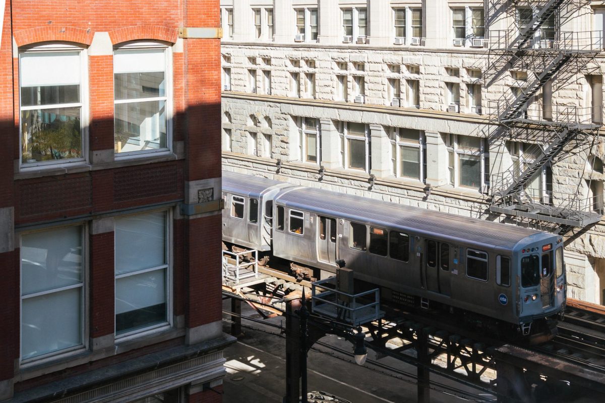 The Orange Line L train passes 33 E. Ida B. Wells Drive on Monday, Oct. 20, 2025. Illinois state lawmakers are working on a $1.5 billion funding bill to assist the CTA, which is facing budget issues due to declining ridership and reduced fare revenue since the COVID-19 pandemic.