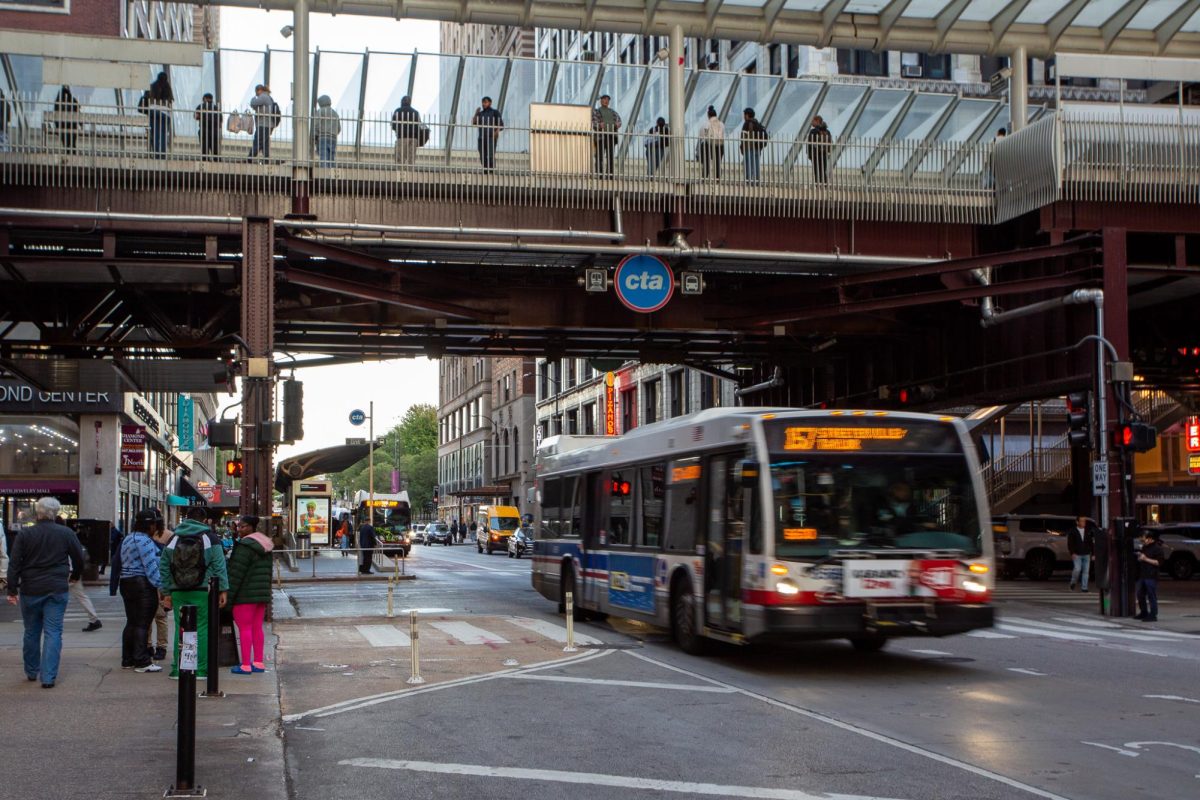 A CTA bus passes under the Washington/Wabash L station Thursday, Oct. 16, 2025, at Madison Street and Wabash Avenue. The CTA announced Oct. 13 that it will increase train fares from $2.50 to $2.75 per ride.