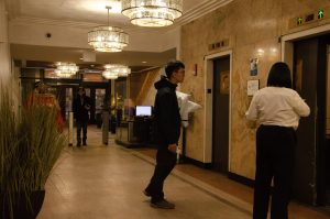 Students walk to the elevators on the first floor lobby of the Arc at Old Colony on Wednesday, Dec. 4, 2025.