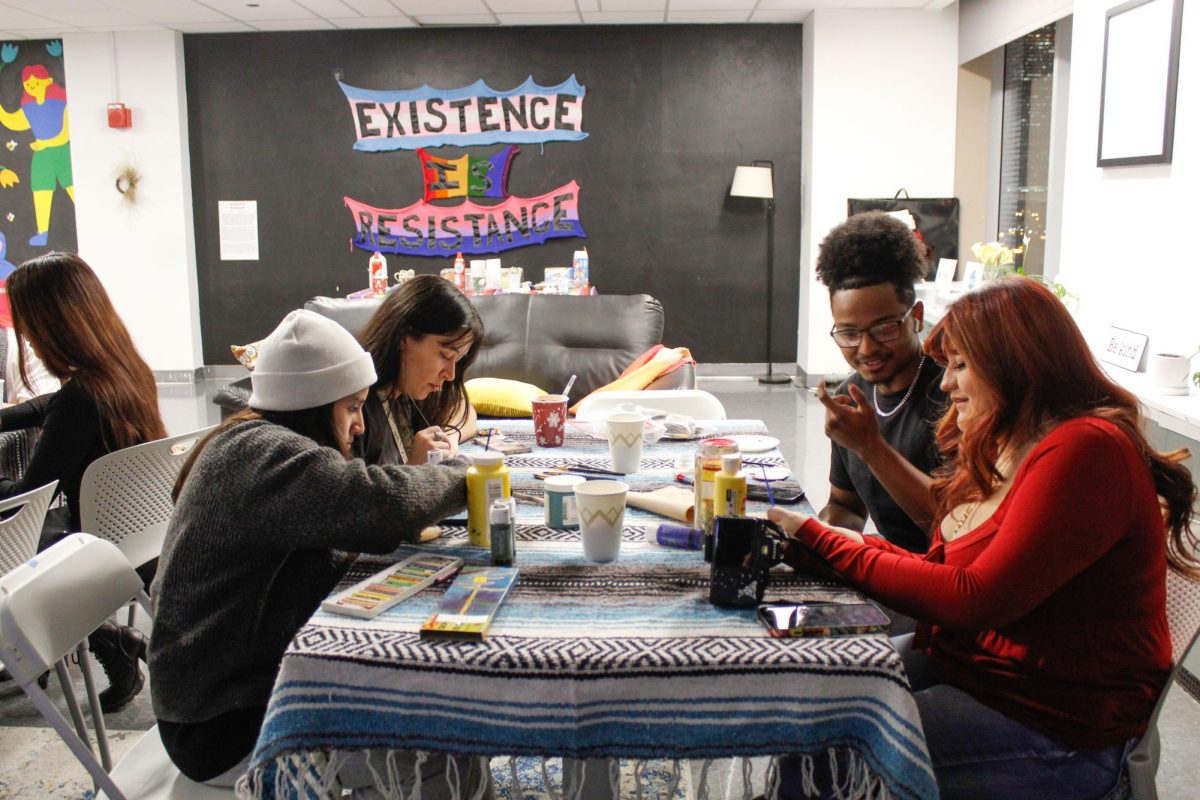 Students paint Christmas ornaments at Latino Alliance's posada on Wednesday, Dec. 10, 2025.
