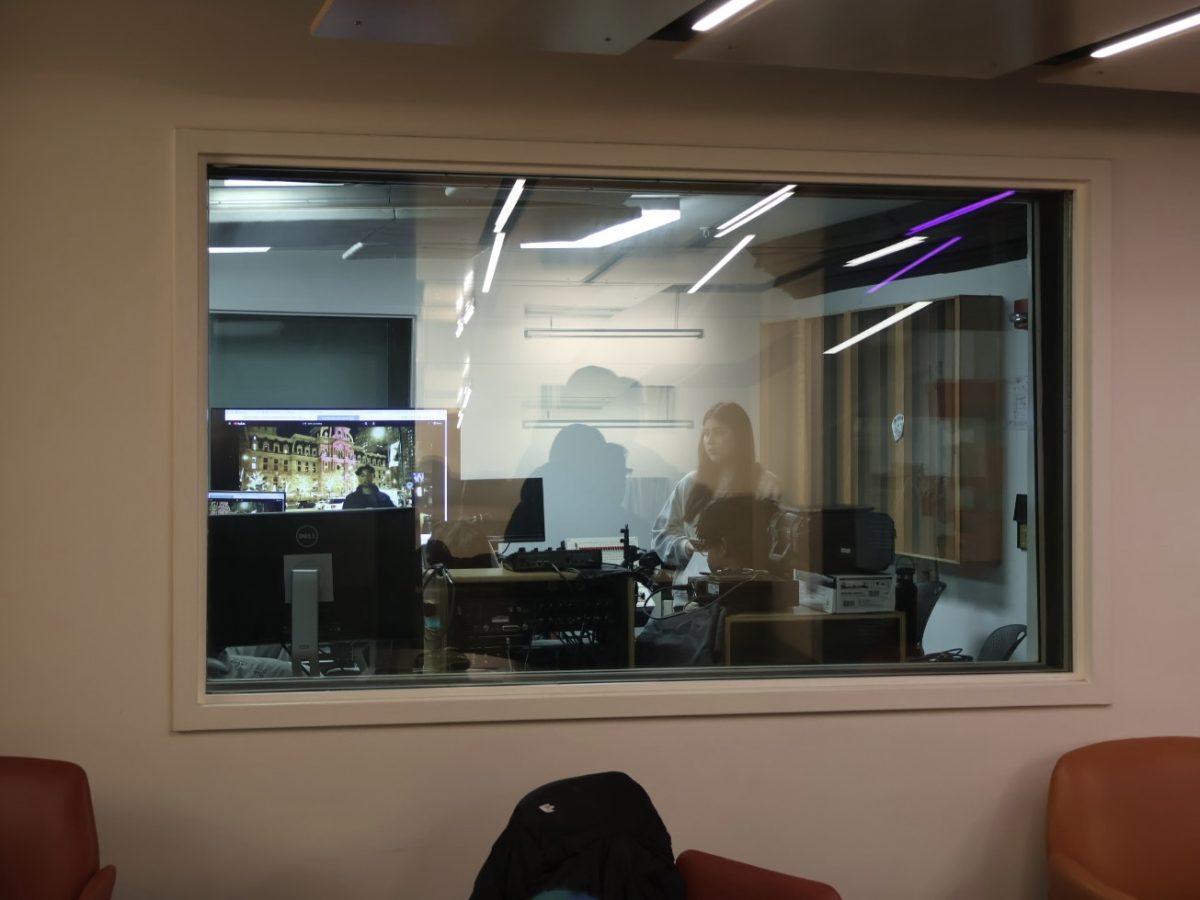 Students prepare for a listening session in the control room on the lower level of the 33 E. Ida B. Wells building on Friday, Jan. 16, 2026.