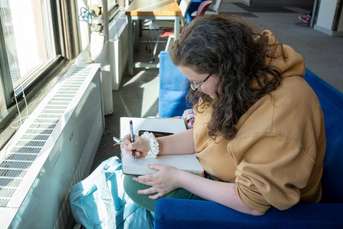 Lil Montague, a sophomore illustration major, works on a self-portrait sketch in the 623 S. Wabash Ave. building on Thursday, Jan. 29, 2025. 