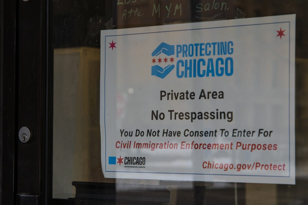 Local hair salon in Little Village with a taped up sign not allowing ICE to enter the establishment on Friday, Jan 30, 2026.