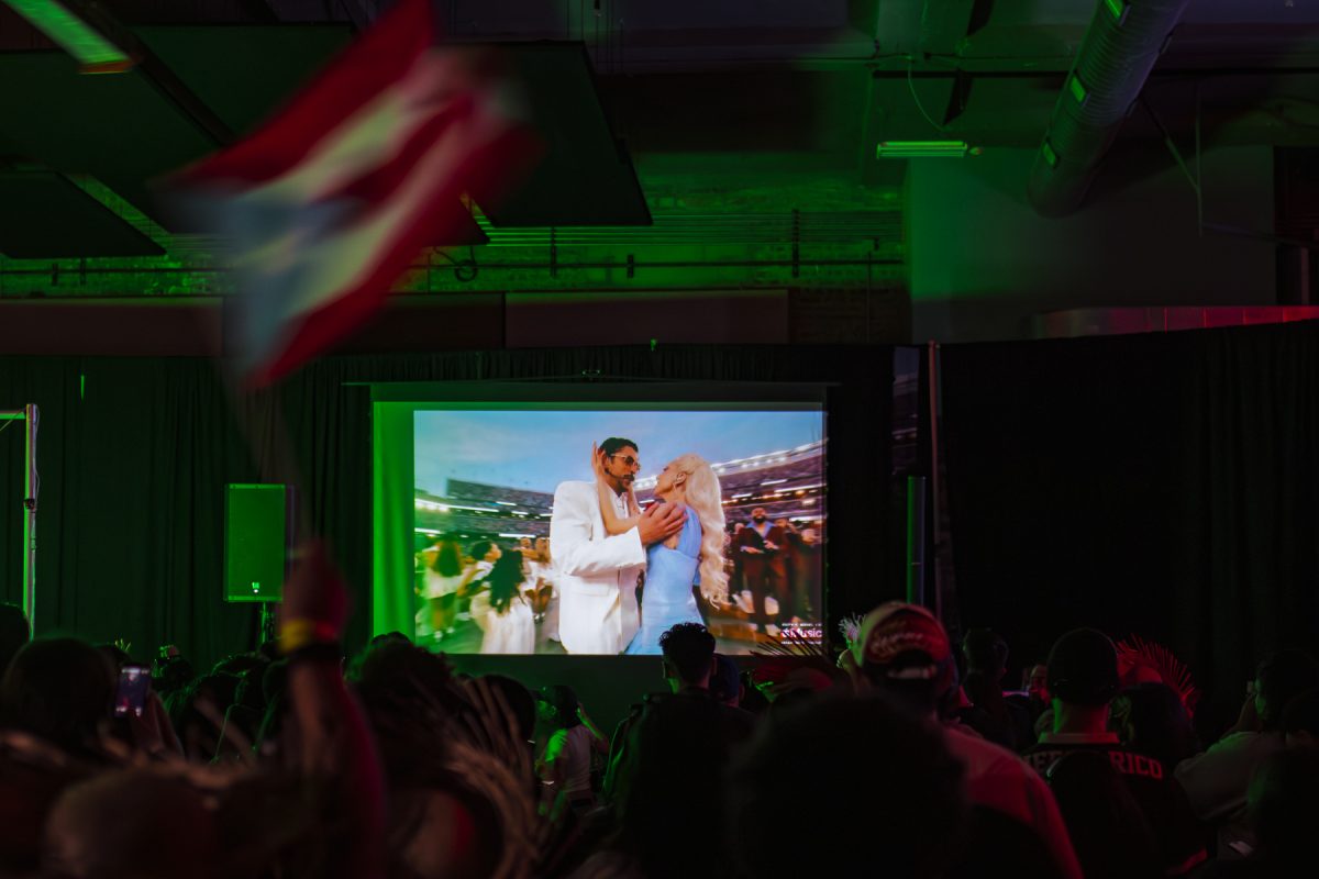 Attendees of Sentido's 18th event watch the Super Bowl halftime show featuring Bad Bunny at SRBCC on Sunday, Feb. 8, 2026. 