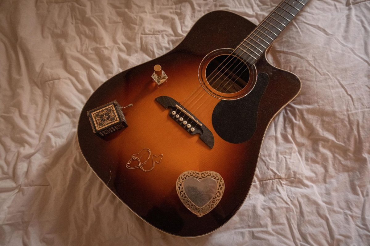 Small gifts and trinkets sit on top of an acoustic guitar on Thursday, Feb. 12, 2026.