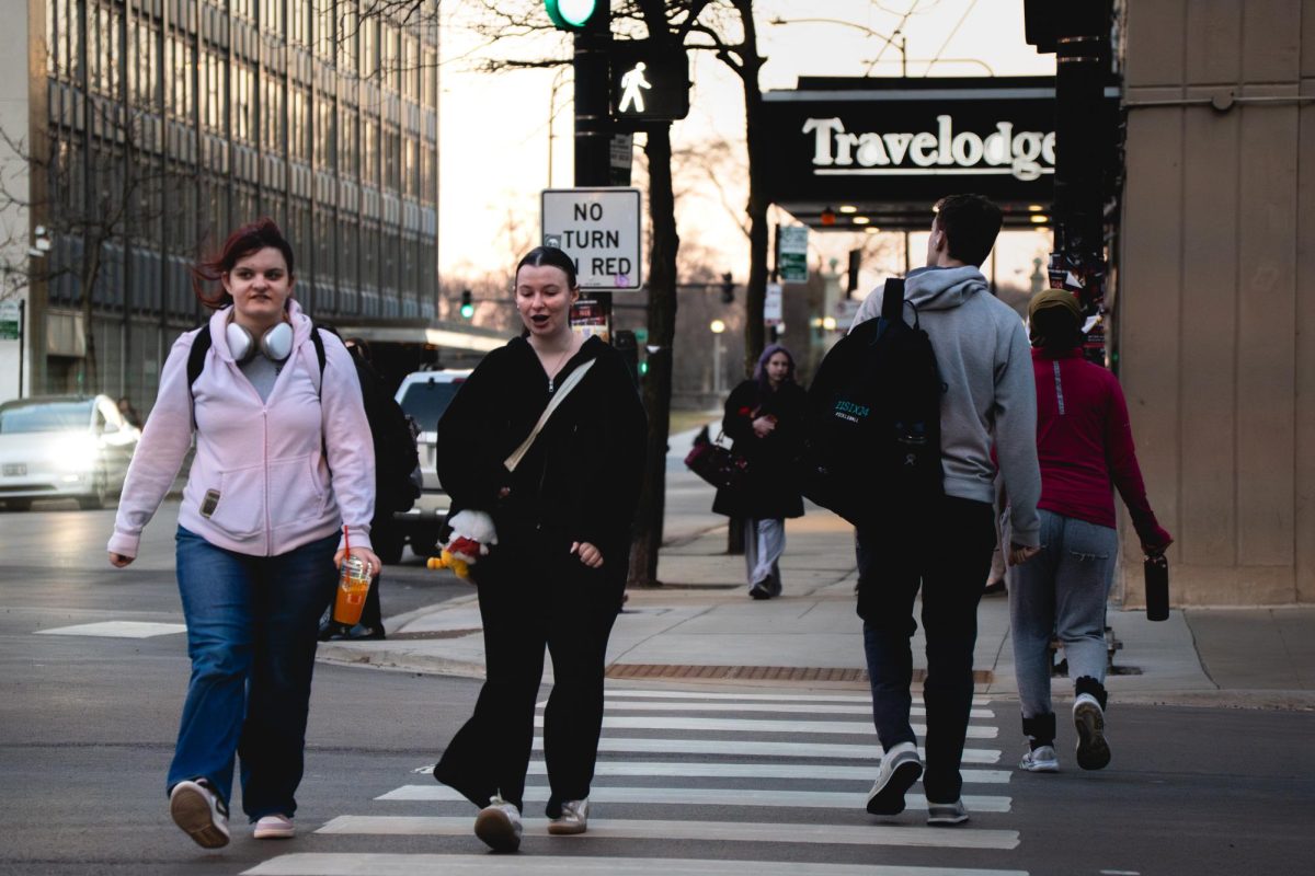 Chicagoans enjoy the warmer weather in the South Loop on Wednesday, Feb. 18, 2026. The temperature reaches a high of 60 degrees. 