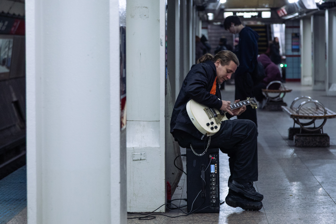 Guitar busker Michael Malinowski performs at the Lake Red Line stop to earn extra money on Friday, Feb. 20, 2026. Malinowski has been busking in Chicago for 10 years. Chronicle photojournalist Amelia Baird, a junior photography major, received an honorable mention for the ICPA's Ron Wiginton Photo Contest with this entry. The photographers were asked to shoot with the prompt "city block." Baird is a photojournalist for the Chronicle.