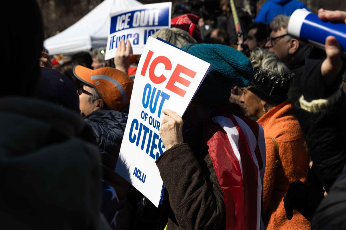 Protestor holds up a sign reading "ICE out of our cities" at the No Kings protest on Saturday, March 28, 2026.
