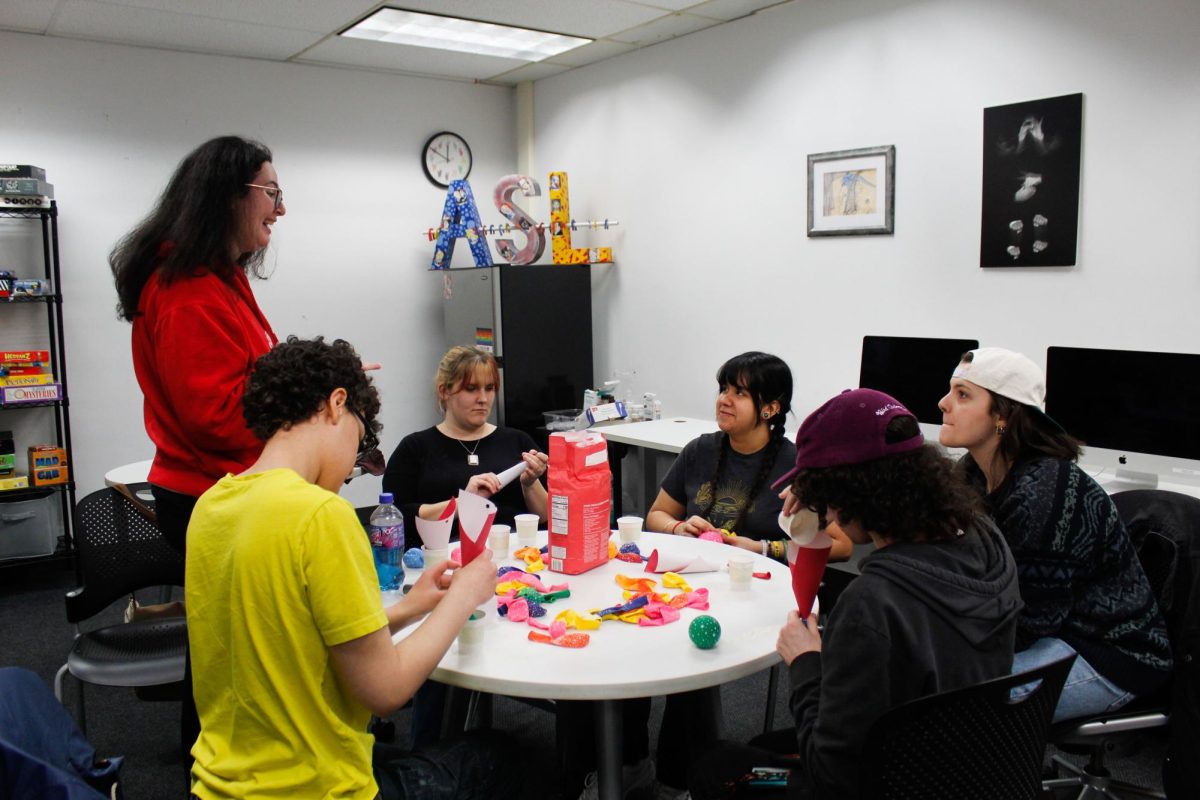 Students sign while making stress balls together as a part of ASL Club's destress fest event, on Friday, March 6, 2026. 