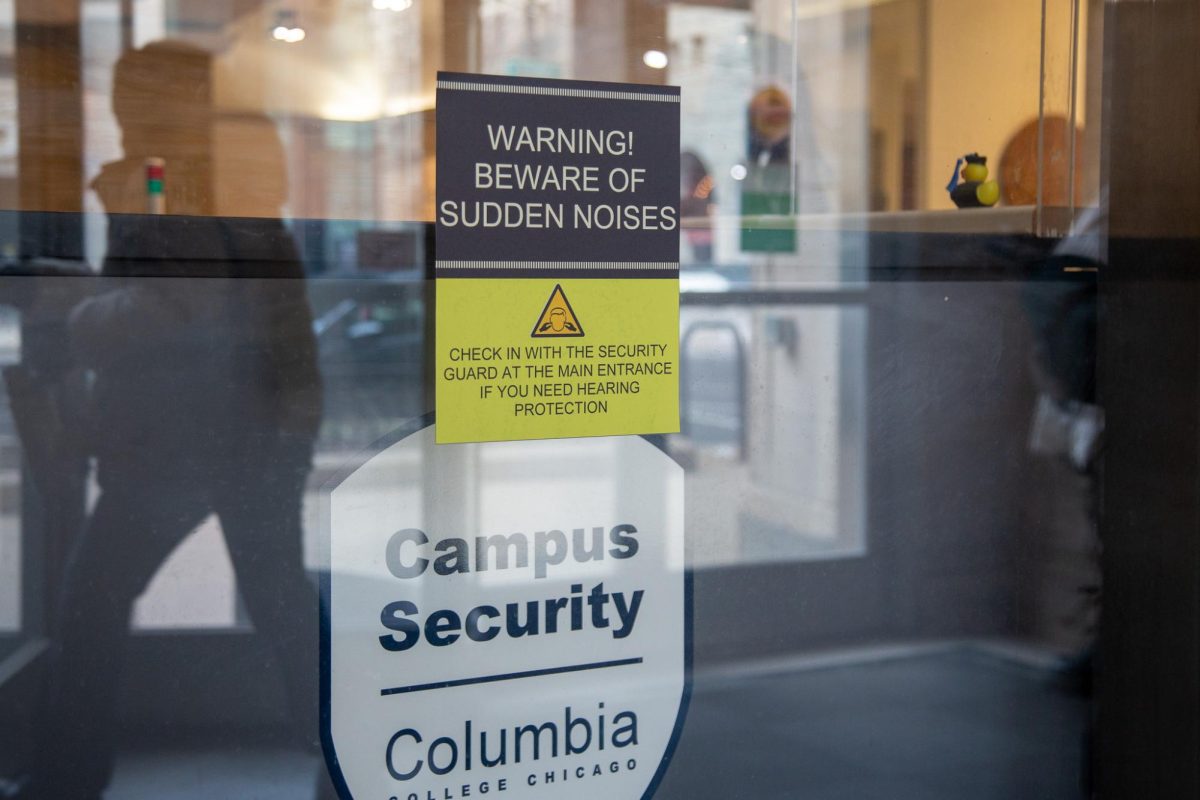 Students pass the construction on the first floor of the 33 E. Ida B Wells Drive building as they exit the building on Thursday, Feb. 26, 2026. The Center for Academic Tutoring is under construction and a sign warning students of sudden noises posted at the security booth. 