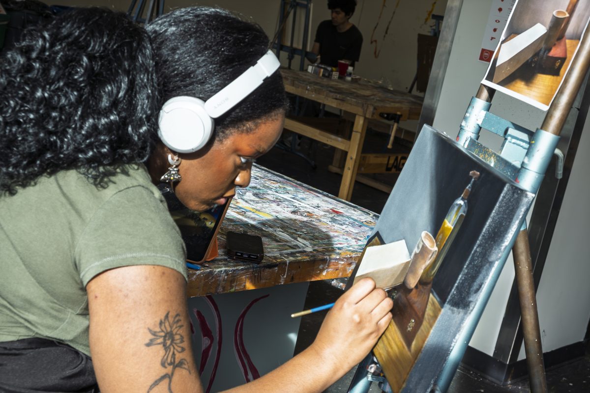 Payton Finley, a sophomore fine arts major, paints on a canvas on the 8th floor of 623 South Wabash Avenue on Thursday, March 12, 2026. 