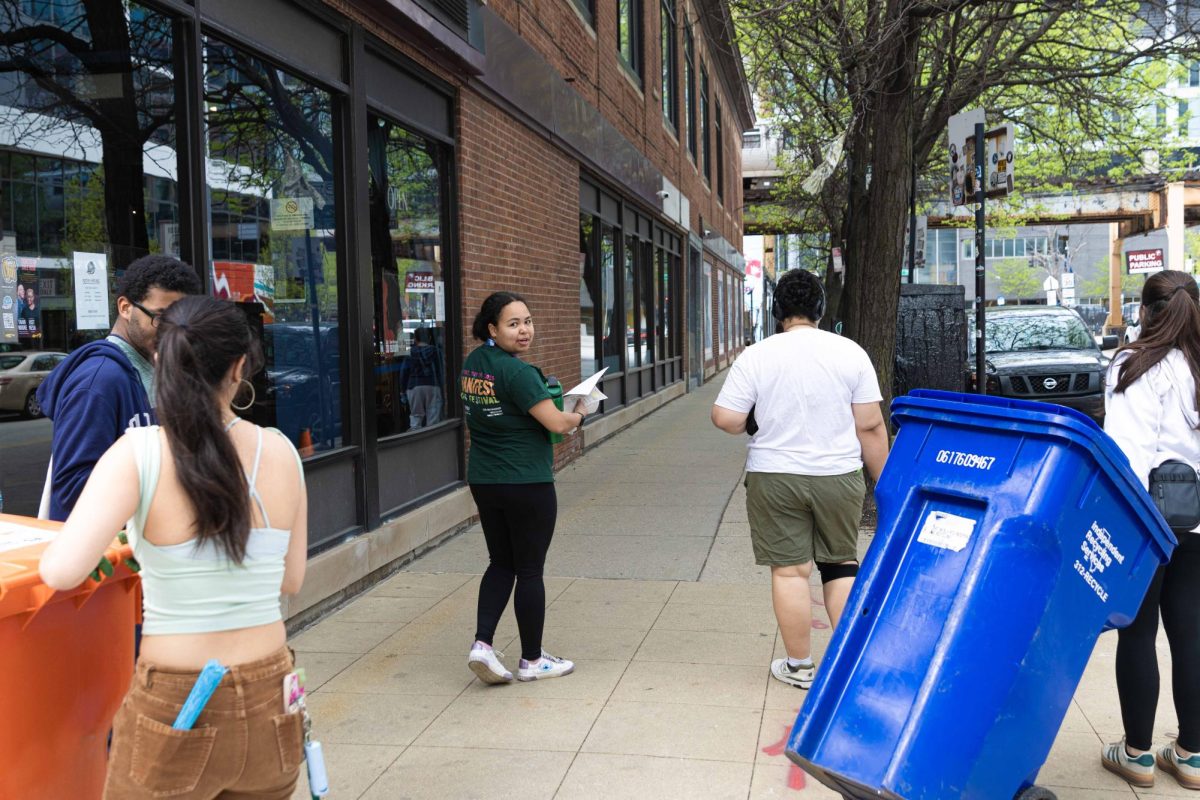Volunteers help clean up at East Balbo Drive on Friday, April 24, 2026. 