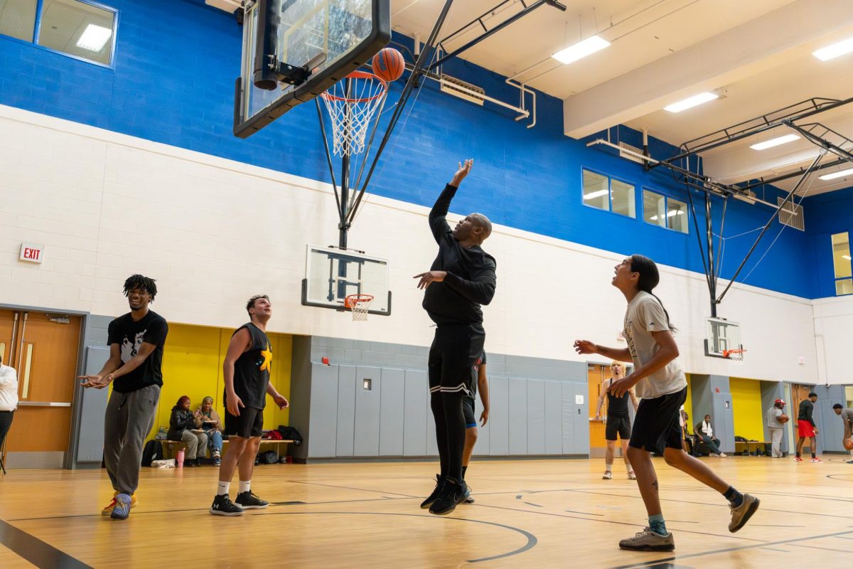 Students and staff compete in a basketball game at the East-West University gym on Wednesday, April 29, 2026.
