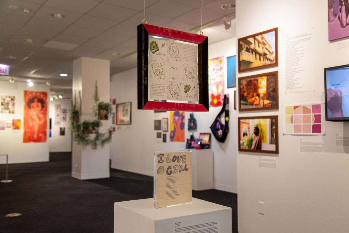 An installation titled "I Love A Girl," created by senior fine arts major Eliana Pinkert, hangs in The Arcade Gallery in the 618 S. Michigan Ave. building for the For Women, By Women art exhibition on Tuesday, April 28, 2026.