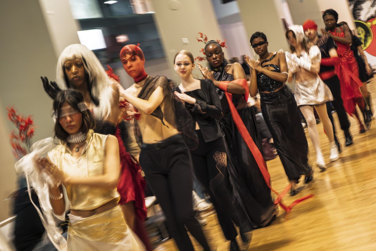 Student models walk down a runway, modeling student and alumni designers at The Conaway Center on 1104 S. Wabash Ave. on Friday, May 8, 2025.