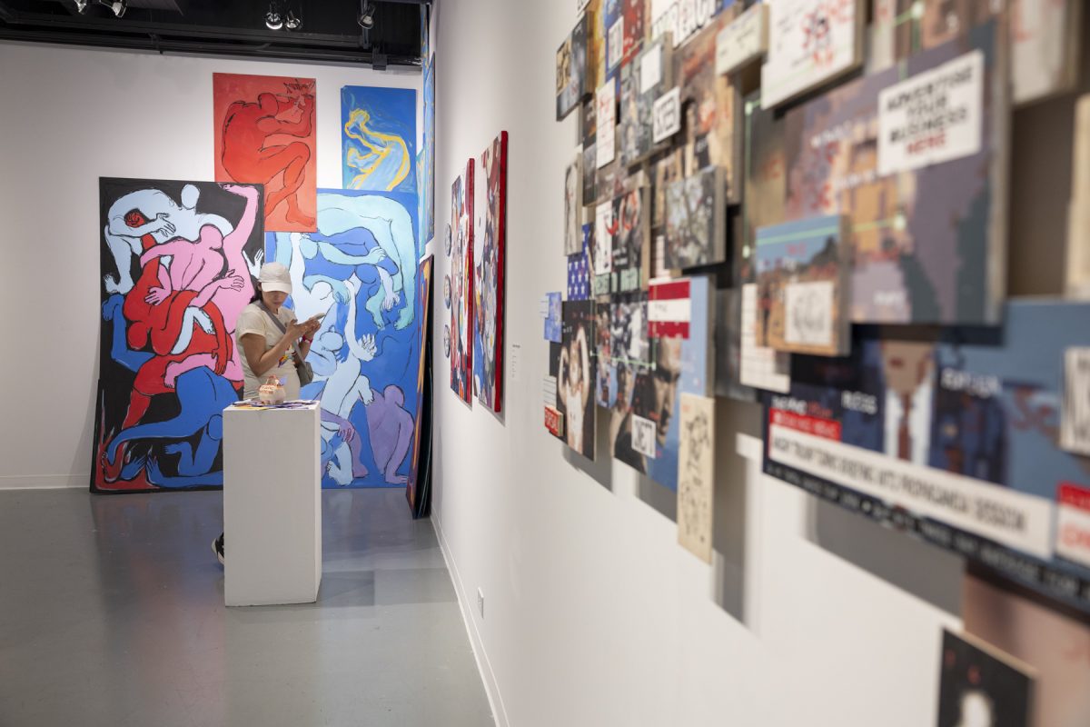 Bianca Sanchez, a Columbia alum who graduated in 2017, looks at the Human Condition exhibit at the C33 Gallery at 33. E. Ida B. Wells Dr., on Saturday, May 16, 2026.