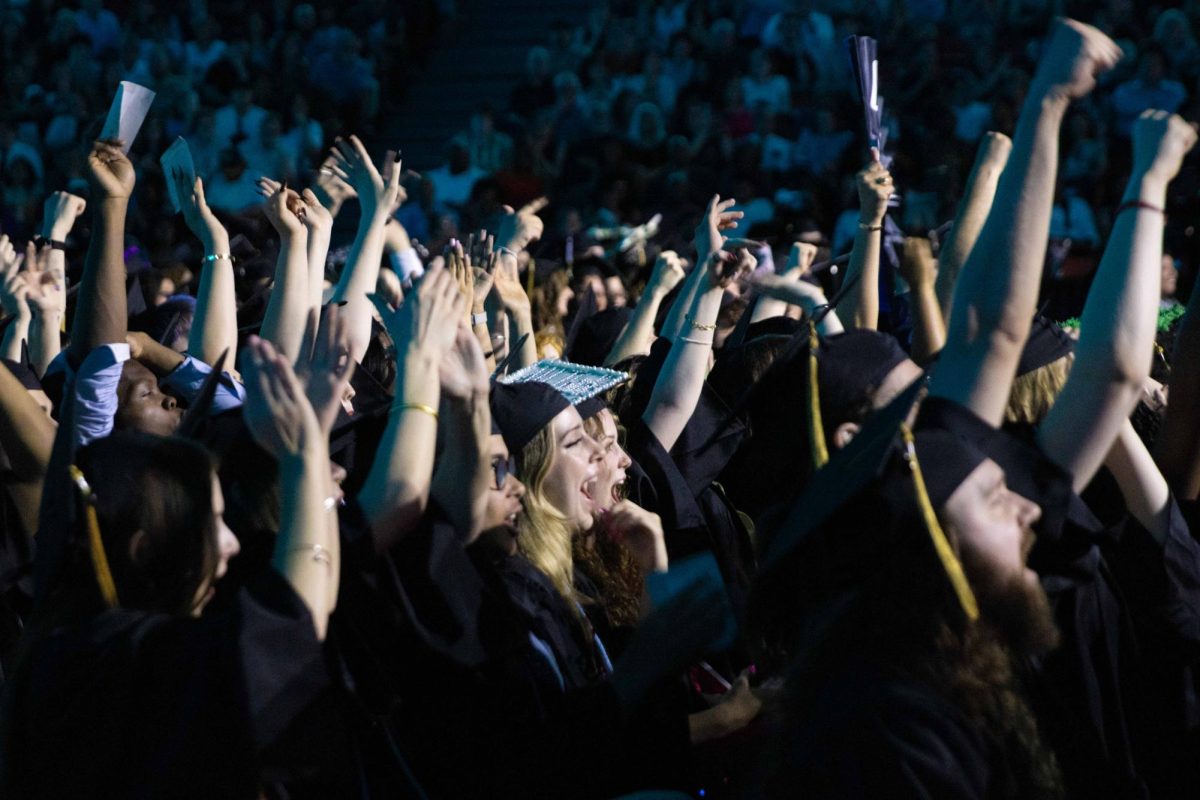 Graduates cheer at the Credit Union 1 Arena on Sunday, May 17, 2026.