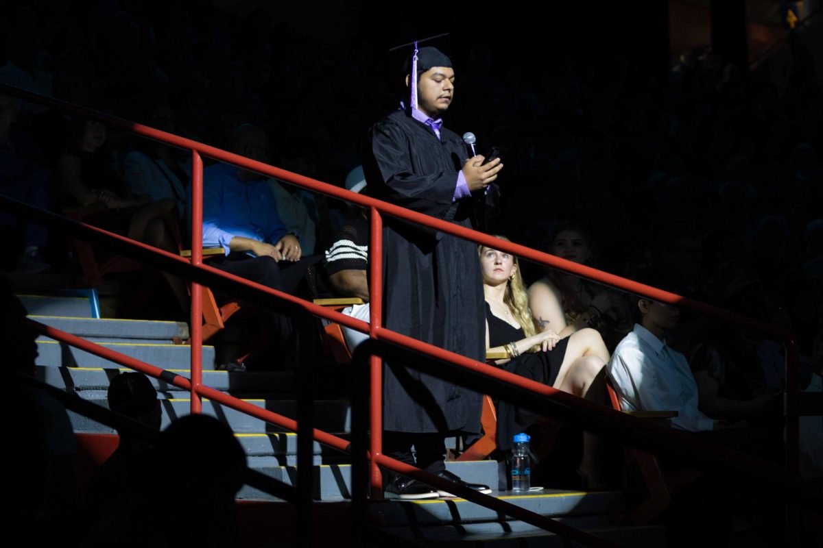 Uriel Centeno, winner of the 2026 Commencement Poetry Competition, reads his poem at the morning commencement ceremony on Sunday, May 17, 2026. 