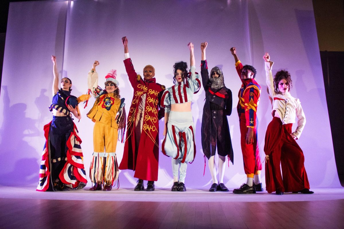 Models of the "Scarlet Vanguard" fashion collection, by Charlee Lambert, showcase the collection's seven designs at the Student Center on Saturday, May 16, 2026. 
