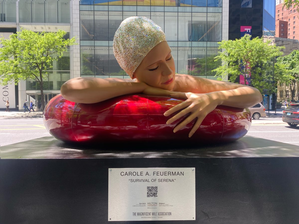 A sculpture by Carole Feuerman, titled Survival of Serena, sits in front of Water Tower Place, Chicago, on Thursday, June 4, 2026.