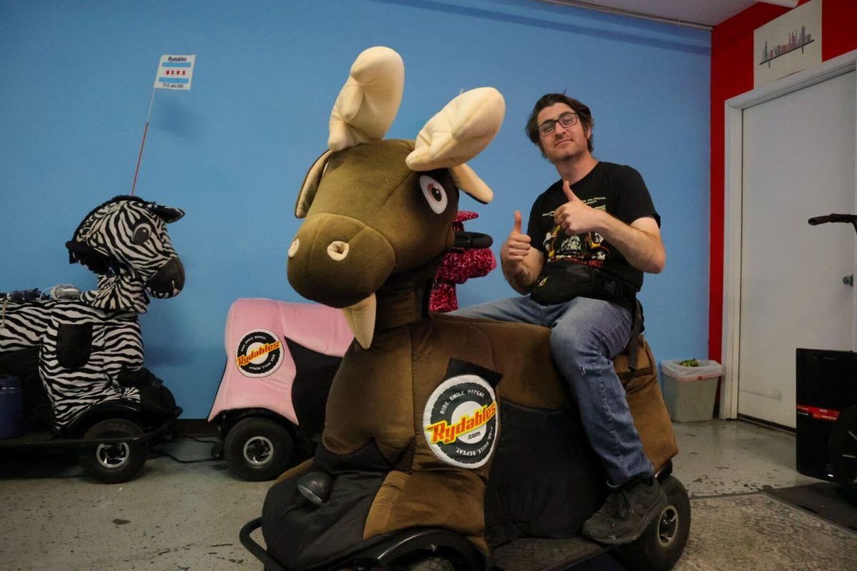 Casey Kells, owner of Windy City Rydables, describes his experience starting a small tourism business in the South Loop of Chicago as he sits on a Rydable on Wednesday, June 3, 2026. Kells's approach to the tourism game comes with a twist, utilizing Segways decorated as colorful characters and animals. This photo is part of the Columbia Chronicle’s "77 Community Areas" project, documenting Chicago ahead of America’s 250th birthday
