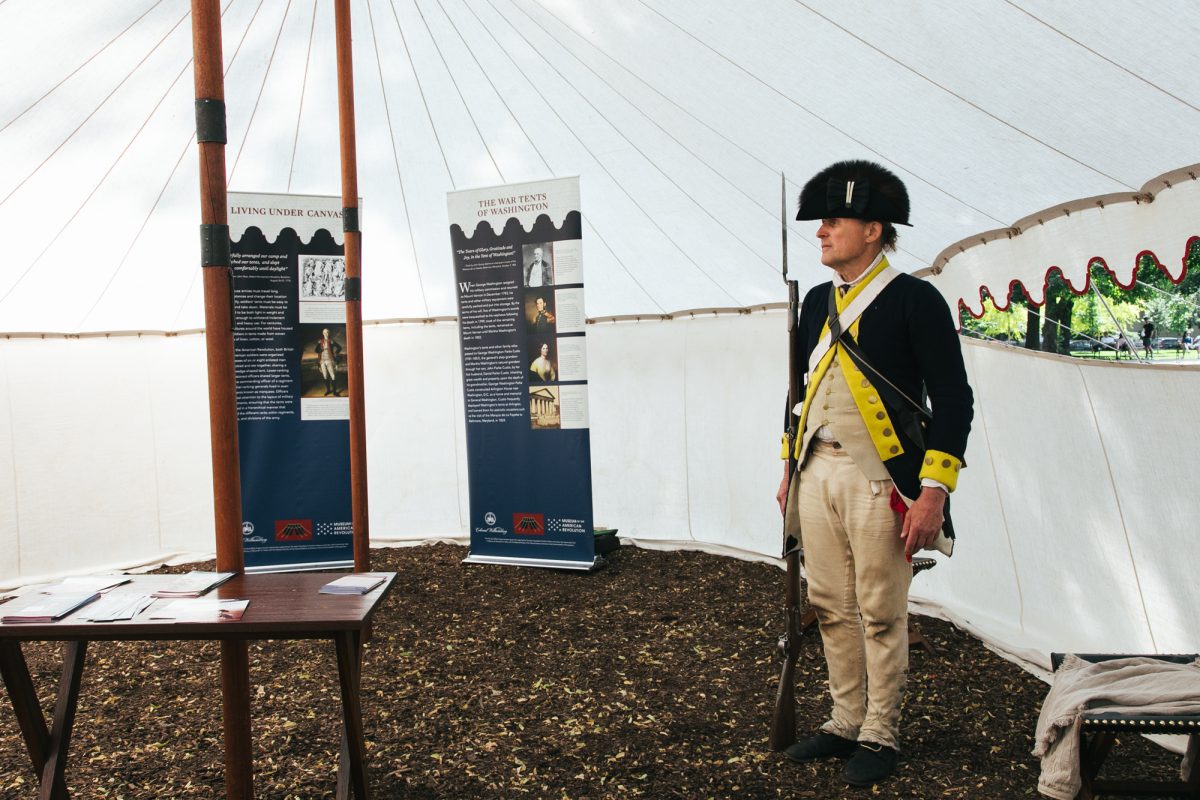 John Rees, researcher and historian, stands at attention in a tent in front of Newberry Library in Chicago on Saturday, June 6, 2026.