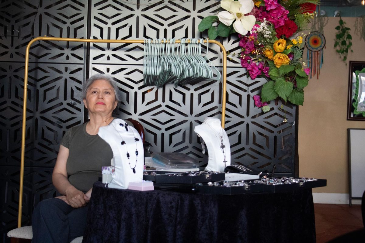 María Blanco sells handmade jewelry at El Capitan Snacks and Cafe in Belmont Cragin on the Northwest Side of Chicago on Friday, June 19, 2026. This photo is part of The Columbia Chronicle's "77 Community Areas" project documenting Chicago ahead of America's 250th birthday.